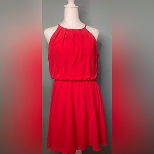 Woman’s red dress with pleated top and flowing skirt size large